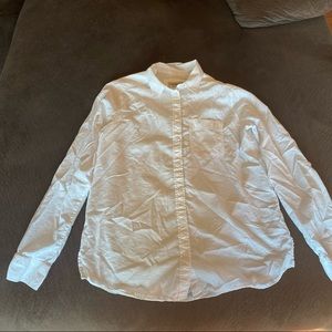 A white button down dress shirt with front pocket